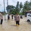 Kapolsek Tanjung Beringin Tanggap Atasi Banjir di Kecamatan Tanjung Beringin